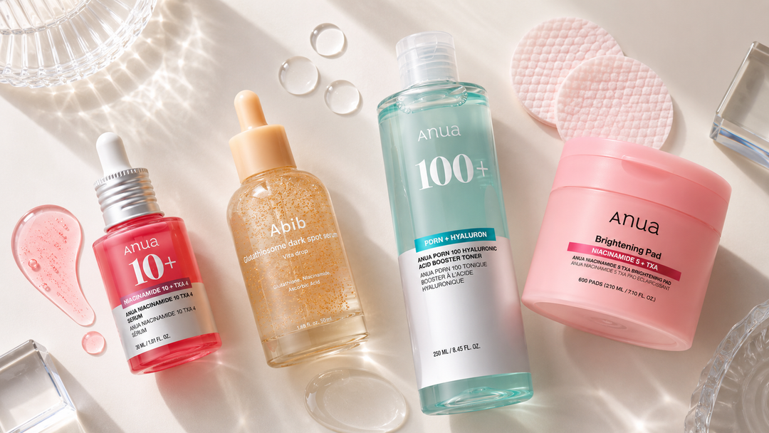Flat lay of RuZu Beauty K-beauty brightening products on white marble
