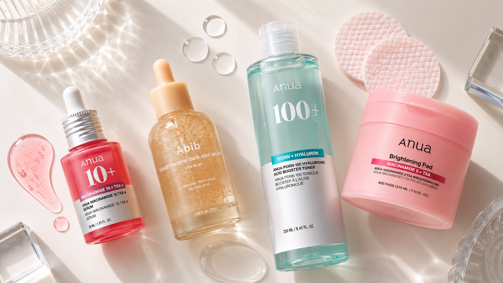 Flat lay of RuZu Beauty K-beauty brightening products on white marble