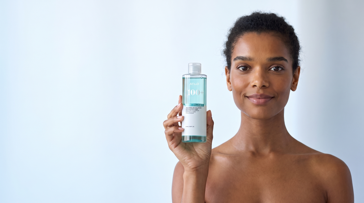 Woman holding the Anua PDRN 100 Hyaluronic Acid Booster Toner in a bright, airy space