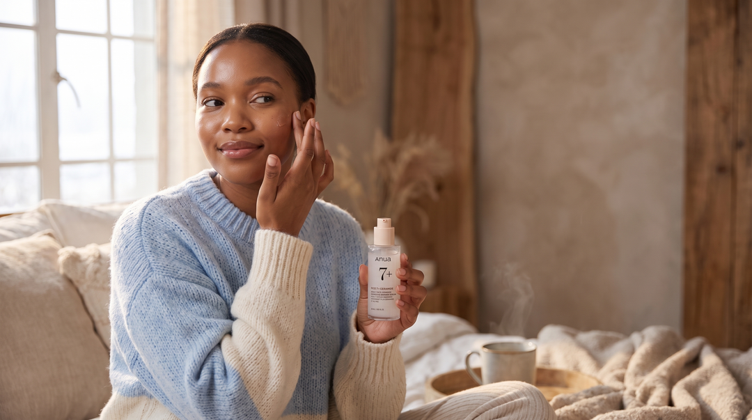 Young South African woman applying a hydrating serum for dry skin on a cool winter morning